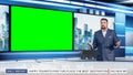 Talk Show TV Program: Handsome White Male Presenter Standing in Newsroom Studio, Uses Big Green