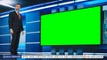 Talk Show TV Program: Handsome White Male Presenter Standing in Newsroom Studio, Uses Big Green