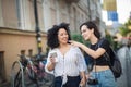 Two tourist women on street