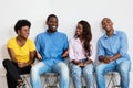 Talking african american group of people in waiting room Royalty Free Stock Photo