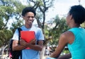 Talking african american male and female student on campus of un Royalty Free Stock Photo