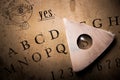 Talking board and planchette Royalty Free Stock Photo