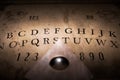 Talking board and planchette Royalty Free Stock Photo