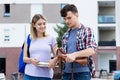 Talking caucasian student couple Royalty Free Stock Photo