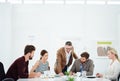 Talking design in the office. a group of designers having a meeting around a table in an office. Royalty Free Stock Photo