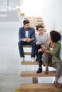 Talking, diversity and team on stairs in modern office for editing career with staff, artistic and ideas. Stairway Royalty Free Stock Photo