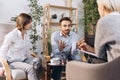 At a psychologist& x27;s appointment. Married couple, sad, depressed man and woman meeting with consultant to solve family Royalty Free Stock Photo