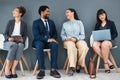 Talking, recruitment and business people in waiting room for interview with human resources. Hr hiring, job and group of Royalty Free Stock Photo