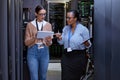 Talking, server room and women with a tablet for cyber security, database planning and inspection. Teamwork, technician Royalty Free Stock Photo