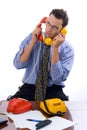 Talking on two telephones Royalty Free Stock Photo