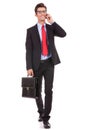 Talking and walking business man Royalty Free Stock Photo