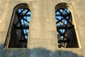 Tall, arched windows in a ruined old industrial building Royalty Free Stock Photo