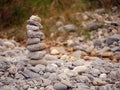 Tall balance stone tower against organic nature background. Concept patience at reaching your target Royalty Free Stock Photo