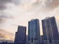 Tall beautiful monolithic-frame panel buildings, new buildings, skyscrapers, houses made of glass and concrete with many windows Royalty Free Stock Photo