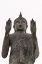 Tall, black statue of Buddha with raised hands to the sky Royalty Free Stock Photo