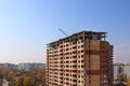 Tall brick building under construction at autumn day Royalty Free Stock Photo