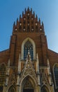 a tall brick church with large arched windows and an ornate steeple Royalty Free Stock Photo