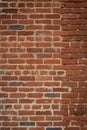 Tall brick wall background, vintage weathered brick partially repointed, creative copy space