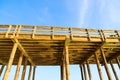 A tall brown wooden pier with long legs with blue sky and light clouds at Ventura Pier Royalty Free Stock Photo