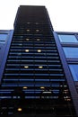 tall building with blinds on the outside to protect from the sun Royalty Free Stock Photo