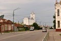 A tall building of a granary standing on one of the streets of the city.