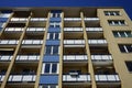 a tall building has windows and balconies on both sides