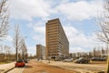 a tall building in the middle of a parking lot Royalty Free Stock Photo