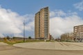 a tall building in the middle of a parking lot Royalty Free Stock Photo