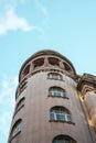 Tall building with numerous windows against a vibrant blue sky in Istanbul, Turkey Royalty Free Stock Photo