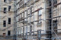 Tall building under construction with scaffolds. Scaffold. Construction Scaffoldings. Royalty Free Stock Photo