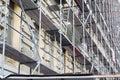 Tall building under construction with scaffolds. Royalty Free Stock Photo