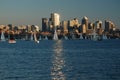 Tall buildings reflect sunlight onto Lake Union