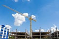 Tall buildings under construction with cranes Royalty Free Stock Photo