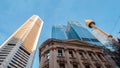 Tall business buildings and Sydney Tower Eye rising towards blue sky Royalty Free Stock Photo