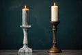 a tall candle stand vs a short candle holder Royalty Free Stock Photo