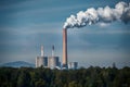 Tall chimney pollutes air with water vapor and smoke pollution