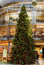 A tall Christmas tree inside of International terminal of Oslo Gardermoen Airport OSL. the second-busiest airport in