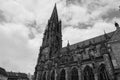 a tall church tower towering over the sky and surrounded by other buildings Royalty Free Stock Photo