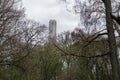 Tall cocrete chimney visible from nearby park in sweden Royalty Free Stock Photo