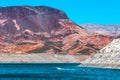 A Tall Colorful Rock Formation at Lake Mead with a Boat