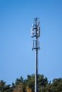Tall communications tower in a forest.. Royalty Free Stock Photo