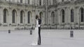 A tall couple in suits posing in the fresh air. Action.A date where people dance and hug in the square. Royalty Free Stock Photo