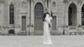 A tall couple in suits posing in the fresh air. Action.A date where people dance and hug in the square. Royalty Free Stock Photo