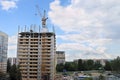 Tall crane works at construction site