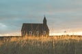 Soft Focus on Grass with BÃºÃ°ir Kirkja in the Background Royalty Free Stock Photo