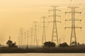 Tall electric towers in the distance in the dusk Royalty Free Stock Photo