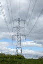 Tall electrical transmission towers at hydro-electric dam Royalty Free Stock Photo