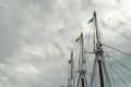 Tall elegant lines of ship masts against grey stormy skyline outside Royalty Free Stock Photo