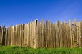 Tall fence under a blue sky Royalty Free Stock Photo