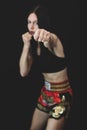 Girl throwing a punch in boxing pose